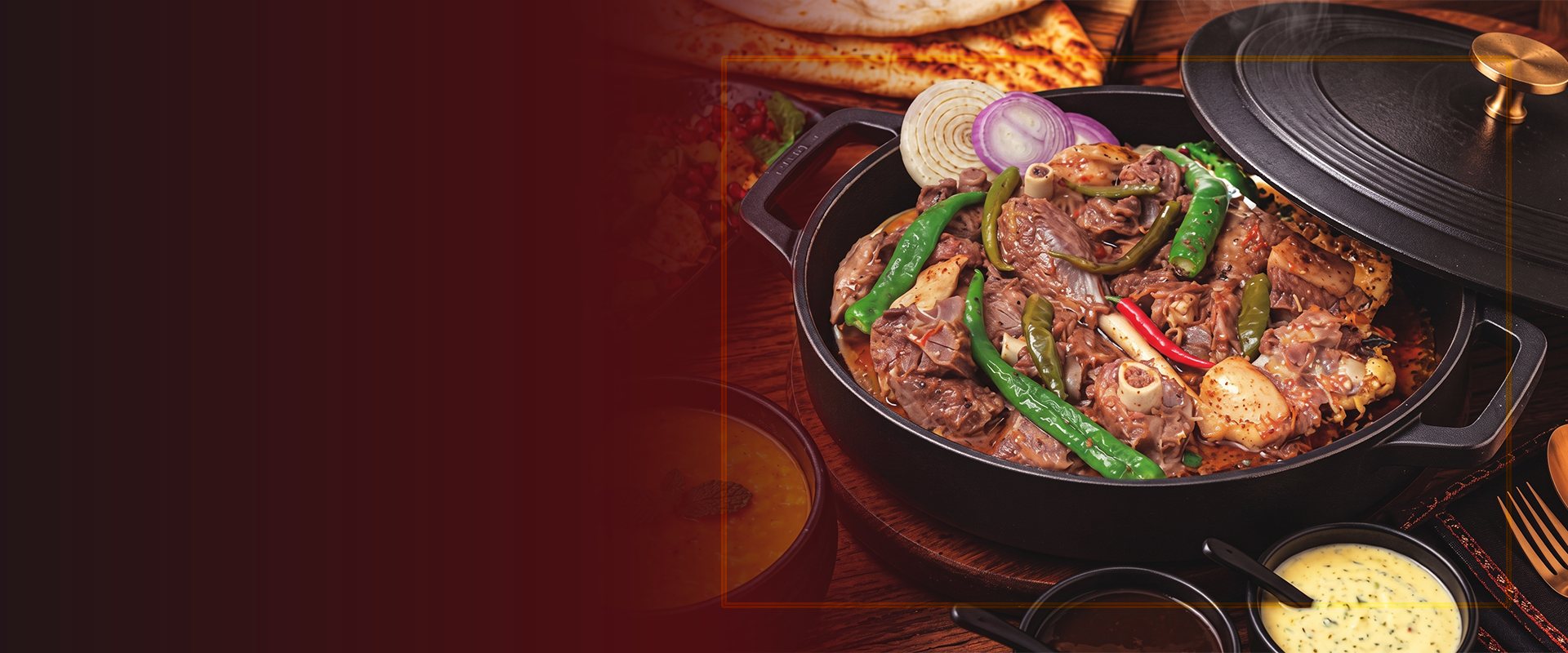 Charsi karahi in a black iron pot with green chillies